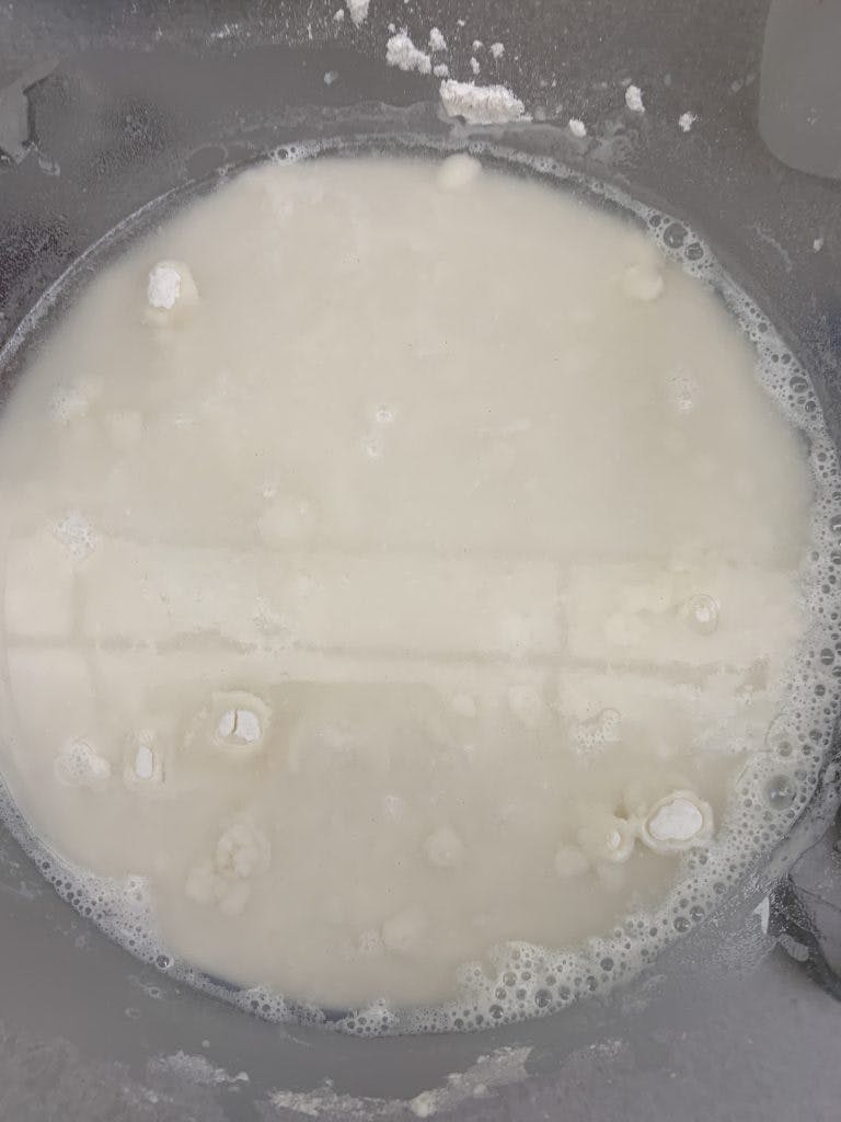 Bowl of flour with water in it.